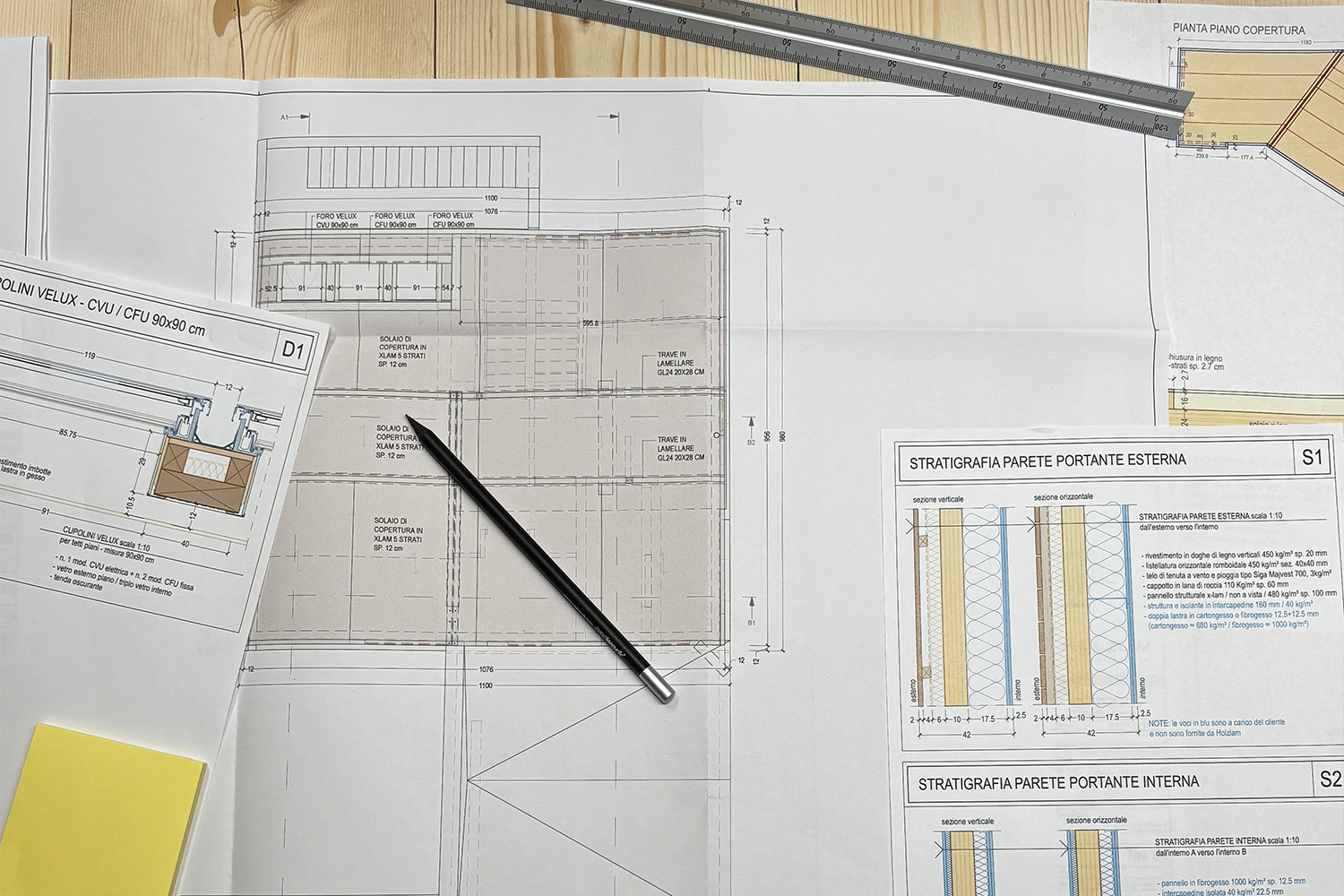 Blueprints and 3D plans on architect table